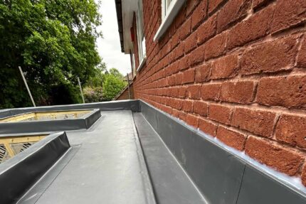 Fitting energy-efficient Celotex roof insulation to meet building regulations on a residential flat roof.