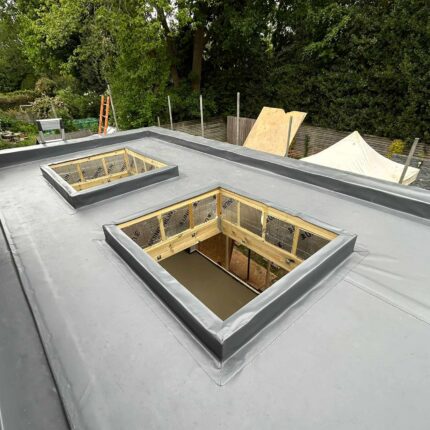 High-performance EPDM flat roof membrane with precision skylight openings, installed by our accredited london roofing specialist team in Kew.