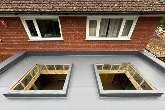 New flat roof installation on a single-storey rear extension at a semi-detached property in Kew, Surrey.
