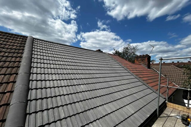 Pitched roof overhaul and concrete tile replacement project underway in Twickenham, London.