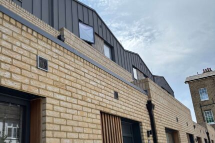 Applying durable Sikaplan single-ply waterproof membrane with flame-free welded seams.
