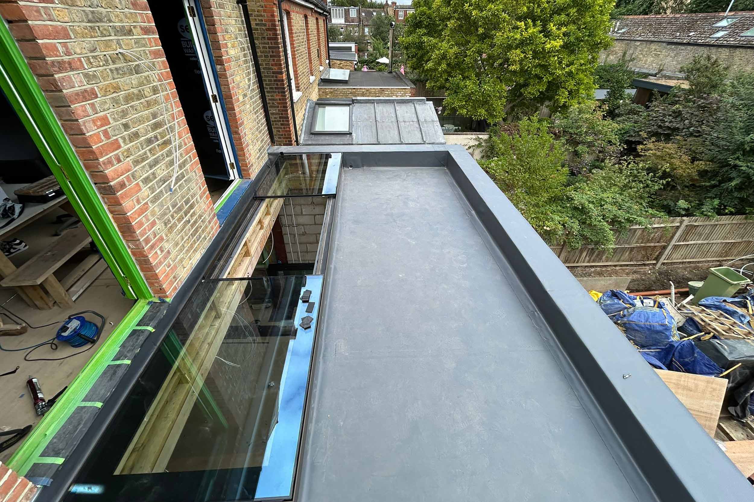 Flat roofer in Barnes London roof specialist roofing company, new build project -installation of a high-performance SikaPro warm roof system.
