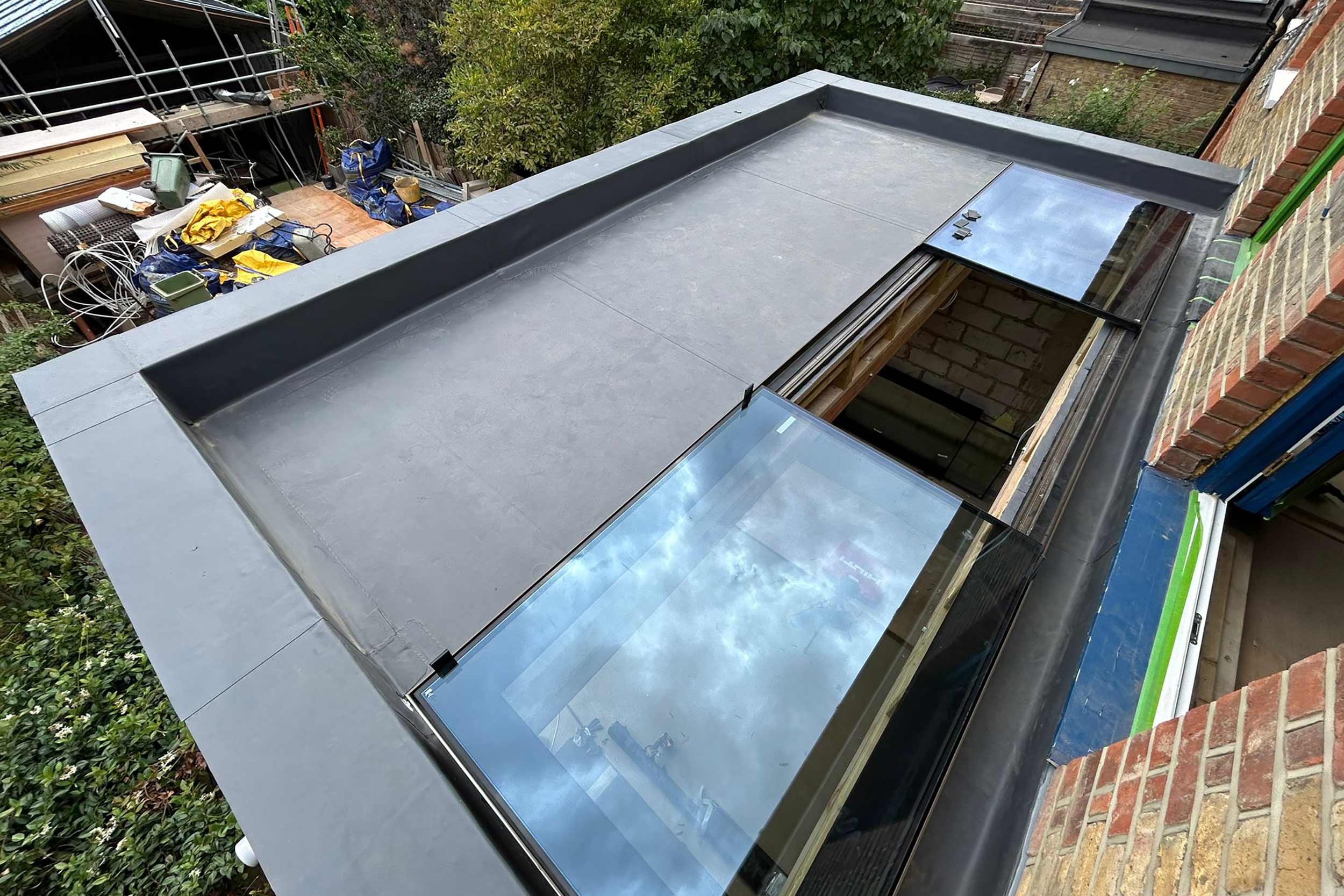 Flat roofer in Barnes London roof specialist roofing company, new build project -installation of a high-performance SikaPro warm roof system.