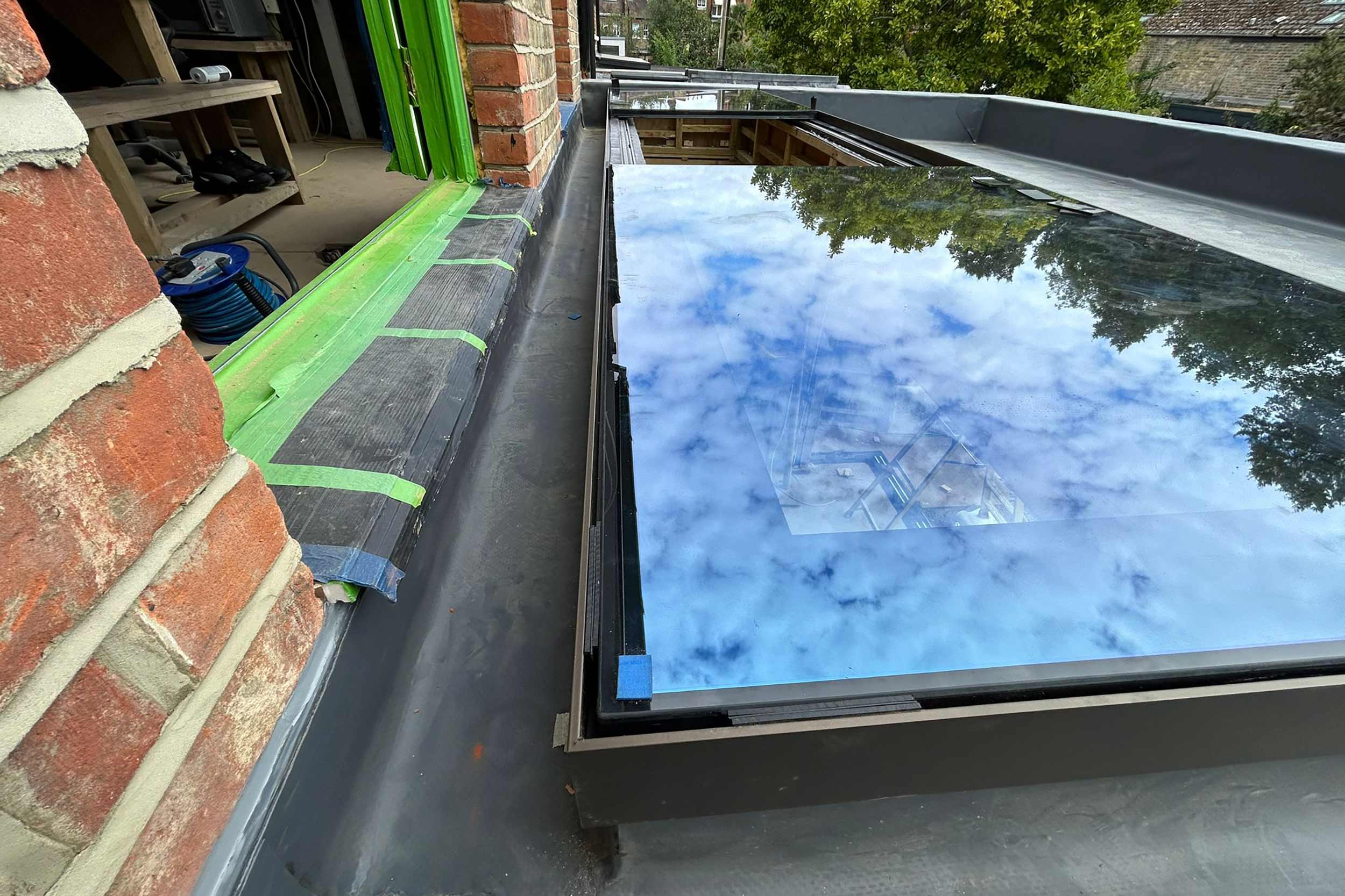 Flat roofer in Barnes London roof specialist roofing company, new build project -installation of a high-performance SikaPro warm roof system.