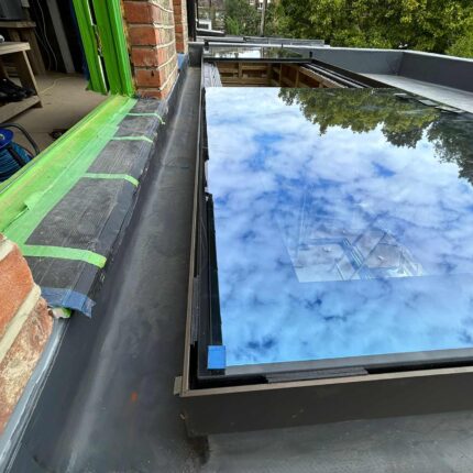 Premium commercial skylight seamlessly integrated into a newly waterproofed flat roof by our london roofing contractors, showcasing robust structural finishing.