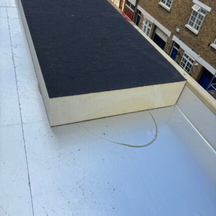 High-performance rigid PIR foam thermal insulation boards precisely fitted to a domestic warm roof system by our specialist flat roofer London team.