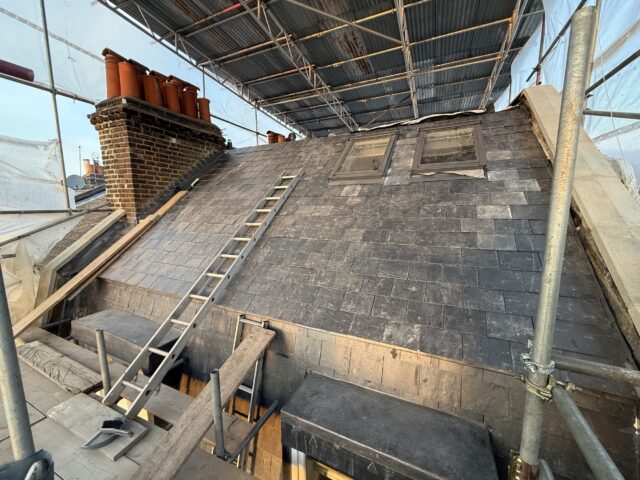 Natural slate roof replacement, stepped chimney lead flashing, and skylight installation in Mayfair W1.